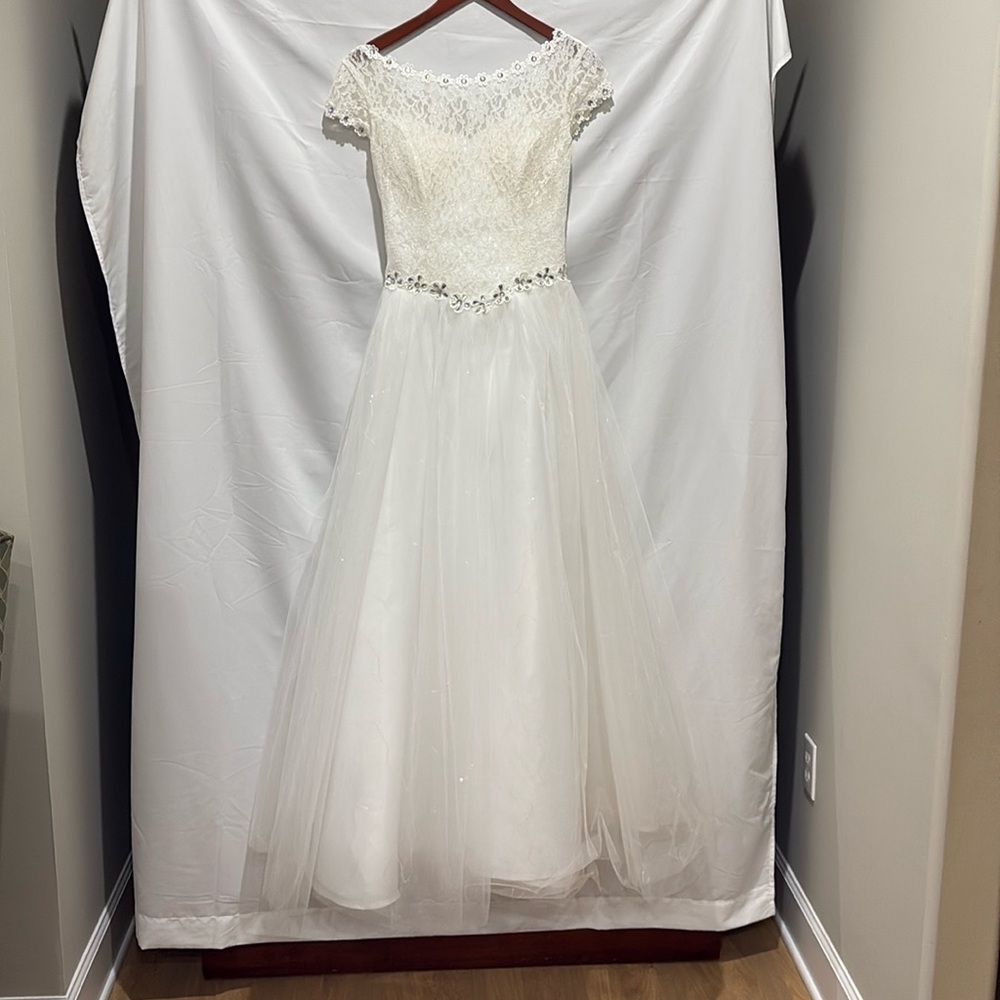 Long white lace and tulle dress with accents
